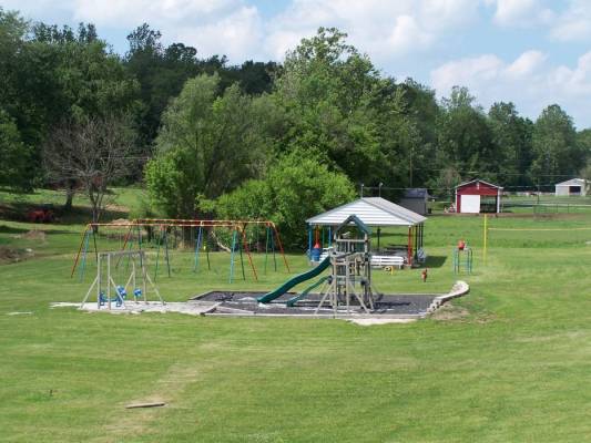 picture of playground area, ball diamond, and shelter house